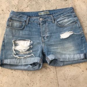 Distressed denim cut-offs